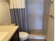 A full bathroom with a ceramic tile shower and shower curtain at 725 Capri Isles Blvd # 217, Venice, FL 34292