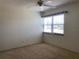 Bedroom featuring neutral carpet and a bright window that provides a comfortable retreat to unwind after a busy day at 725 Capri Isles Blvd # 217, Venice, FL 34292