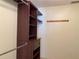 Walk-in closet featuring built-in shelves, drawers and hanging rods at 725 Capri Isles Blvd # 217, Venice, FL 34292
