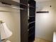 Custom closet with dark wood shelves and lots of room for storage at 725 Capri Isles Blvd # 217, Venice, FL 34292