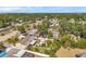 Aerial view of neighborhood with lush landscaping and a beautiful pool at 7508 9Th N Ave, St Petersburg, FL 33710