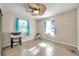 Simple bedroom with twin windows, ceiling fan, and ample natural light at 7508 9Th N Ave, St Petersburg, FL 33710