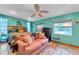 Comfortable bedroom with tiled floors, vibrant walls, and a cozy seating area at 7508 9Th N Ave, St Petersburg, FL 33710