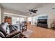 Bright living room with tile flooring, comfortable leather sofa, and dining area at 7508 9Th N Ave, St Petersburg, FL 33710