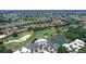 Aerial view of property with pool overlooking a golf course at 7728 Club Ln, Sarasota, FL 34238