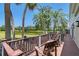 Enjoy amazing views of the lake from this beautiful back deck with comfortable seating at 7728 Club Ln, Sarasota, FL 34238