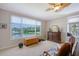 Bright, waterfront bedroom with large windows offering panoramic views at 7728 Club Ln, Sarasota, FL 34238