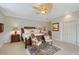 Comfortable bedroom featuring a woven-frame bed and two chairs set on a decorative rug at 7728 Club Ln, Sarasota, FL 34238