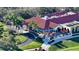 A captivating aerial of the clubhouse and its outdoor dining areas at 7728 Club Ln, Sarasota, FL 34238
