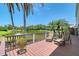 Relaxing deck with stunning lake views and comfortable lounge chairs at 7728 Club Ln, Sarasota, FL 34238