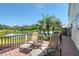 Relaxing deck with stunning lake views and comfortable lounge chairs at 7728 Club Ln, Sarasota, FL 34238