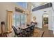 Dining room with high ceilings, chandelier, and views of the outdoors at 7728 Club Ln, Sarasota, FL 34238