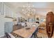 Dining room with a view of the living room and staircase at 7728 Club Ln, Sarasota, FL 34238