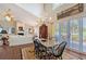Dining room with hardwood floors, chandelier, and an open-concept layout at 7728 Club Ln, Sarasota, FL 34238