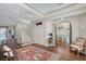 Spacious foyer with hardwood floors and staircase to the second floor at 7728 Club Ln, Sarasota, FL 34238