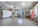 Spacious garage with epoxy floors, storage cabinets, and a refrigerator at 7728 Club Ln, Sarasota, FL 34238