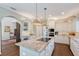 Kitchen with granite countertops, stainless steel appliances, and hardwood floors at 7728 Club Ln, Sarasota, FL 34238