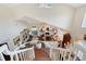 Expansive living room with vaulted ceilings and clear views from the staircase landing at 7728 Club Ln, Sarasota, FL 34238