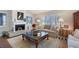 Comfortable living room featuring a fireplace and natural lighting at 7728 Club Ln, Sarasota, FL 34238