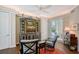 Cozy living room with custom built-ins, comfortable seating, and natural light at 7728 Club Ln, Sarasota, FL 34238
