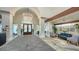 Elegant lobby with soaring archways, stone floors, and sophisticated furnishings, creating a welcoming and luxurious atmosphere at 7728 Club Ln, Sarasota, FL 34238