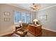 Traditional office with wooden desk, leather chair, and plantation shutters for privacy at 7728 Club Ln, Sarasota, FL 34238