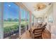 Inviting sunroom with golf course views and comfortable seating at 7728 Club Ln, Sarasota, FL 34238