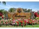 The Prestancia community sign with beautiful flower beds and landscaping creates a welcoming entrance at 7728 Club Ln, Sarasota, FL 34238