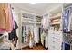 Custom walk-in closet with built-in shelving, drawers, and plenty of storage space at 7728 Club Ln, Sarasota, FL 34238