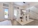 Bright dining room with wood table, white chairs, high ceilings, and lots of natural light at 8133 Grande Shores Dr, Sarasota, FL 34240