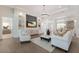 Beautiful living room with elegant furniture and an open layout, featuring a pool view in the background at 8133 Grande Shores Dr, Sarasota, FL 34240