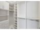 Spacious walk-in closet with custom shelving, drawers, and ample storage solutions at 8133 Grande Shores Dr, Sarasota, FL 34240