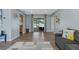 Open living room with tile floors, light blue walls, and sliding door access to backyard at 816 Wabash Rd, Venice, FL 34293