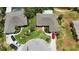 Aerial view of the property, showcasing lush landscaping, long driveway, and the red sports car at 8808 44Th Avenue W Dr, Bradenton, FL 34210