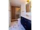 Updated bathroom showcasing a glass-enclosed shower and modern vanity with gold hardware at 8808 44Th Avenue W Dr, Bradenton, FL 34210
