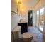 Bathroom featuring double sink vanity, stylish tile flooring and sliding glass door to a patio at 8808 44Th Avenue W Dr, Bradenton, FL 34210