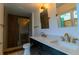Modern bathroom with dual sinks, stylish fixtures, and a luxurious shower at 8808 44Th Avenue W Dr, Bradenton, FL 34210
