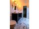 Bathroom featuring double sink vanity, modern lighting, and beautiful hexagon-shaped tile flooring at 8808 44Th Avenue W Dr, Bradenton, FL 34210