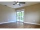Bright bedroom features wood floors, ceiling fan and access to an outdoor porch at 8808 44Th Avenue W Dr, Bradenton, FL 34210