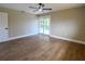 Spacious bedroom with wood flooring, ceiling fan, and sliding glass door access at 8808 44Th Avenue W Dr, Bradenton, FL 34210