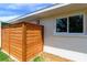 Exterior corner of home featuring a privacy wall, a window, and greenery at 8808 44Th Avenue W Dr, Bradenton, FL 34210
