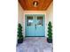 Elegant double front doors in light blue with a decorative transom and stone tile entryway at 8808 44Th Avenue W Dr, Bradenton, FL 34210