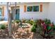 Attractive home with a blue front door, wooden shutters, and a beautifully landscaped front yard at 8808 44Th Avenue W Dr, Bradenton, FL 34210