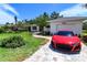 Inviting curb appeal with lush lawn, mature landscaping and brick paver driveway at 8808 44Th Avenue W Dr, Bradenton, FL 34210