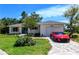 Inviting curb appeal with lush lawn, mature landscaping and brick paver driveway at 8808 44Th Avenue W Dr, Bradenton, FL 34210