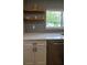 Close-up of kitchen features including quartz countertops, stainless steel dishwasher and patterned tile backsplash at 8808 44Th Avenue W Dr, Bradenton, FL 34210