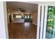 Bright open floorplan with new floors, modern kitchen, and view of backyard at 8808 44Th Avenue W Dr, Bradenton, FL 34210