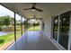 Enclosed lanai with tile floors, screening, and waterfront views at 8808 44Th Avenue W Dr, Bradenton, FL 34210