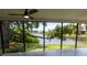 Covered patio with view of a lake, ceiling fan, and tile flooring at 8808 44Th Avenue W Dr, Bradenton, FL 34210