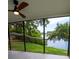 The patio has a ceiling fan and a view of a lake at 8808 44Th Avenue W Dr, Bradenton, FL 34210